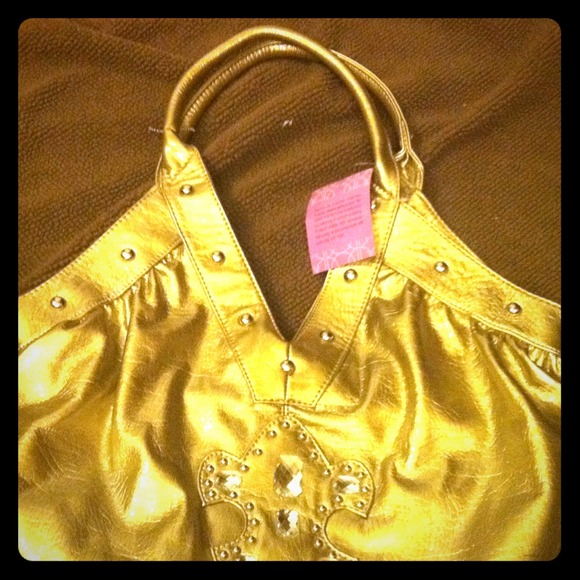 Silver cross purse, by Paula Abdul