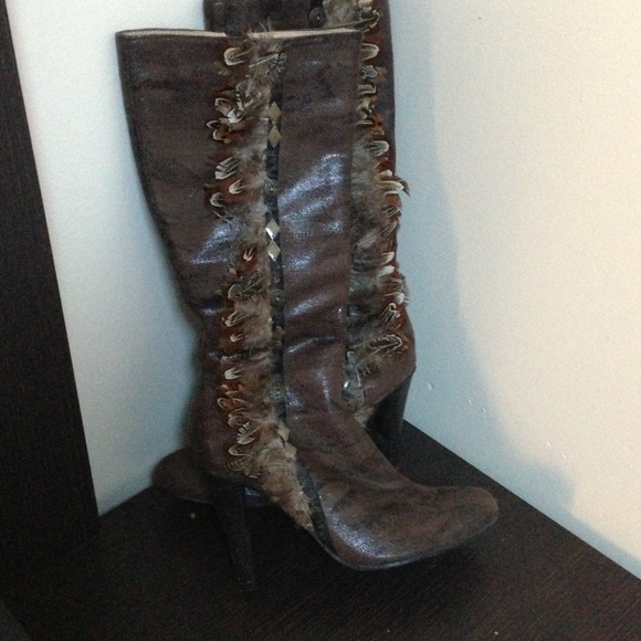 Funky brown boots with feather details.