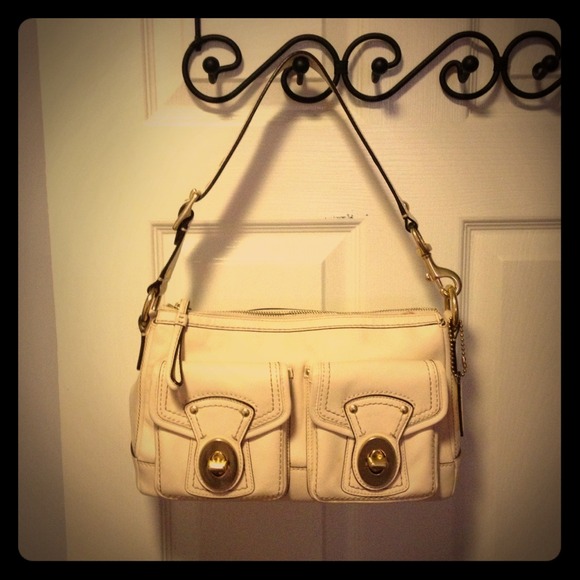 Coach white leather handbag with brass buckles