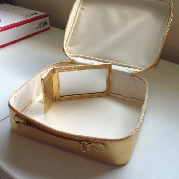 Makeup case with hand mirror.
