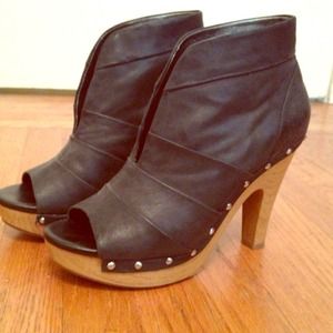 Black leather peep toe heels with studded bottom