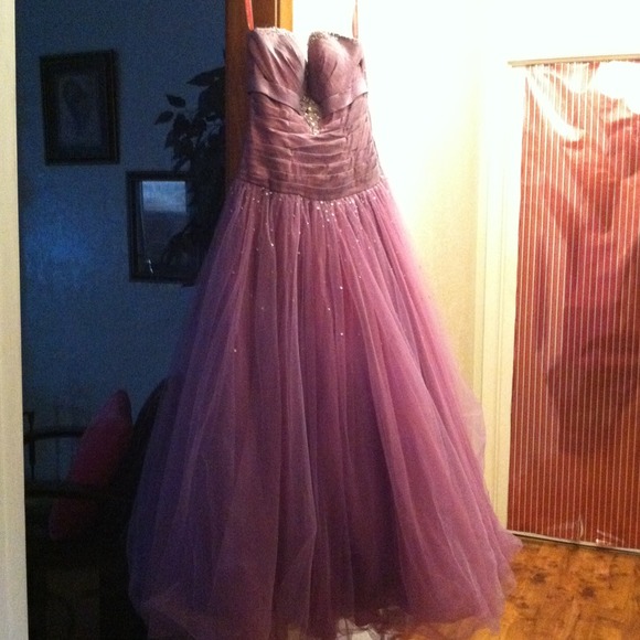 A beautiful purple prom gown.
