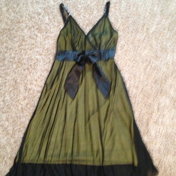 Sheer black cocktail dress with yellow lining.