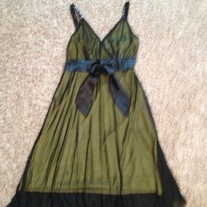 Sheer black cocktail dress with yellow lining.