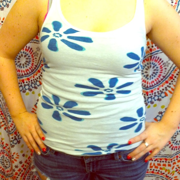 Comfy white tank with blue Hawaiian flowers.