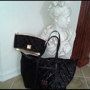 Dooney & Bourke Travel Duffle & free toilette.