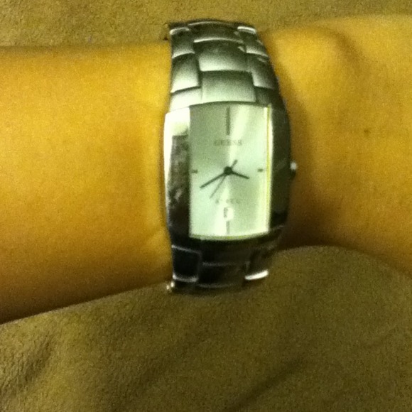 Men's guess watch but can be made to fit a woman