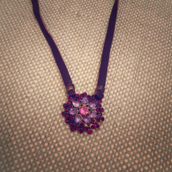 Leather strap and purple jewel tone necklace