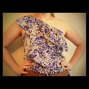 One sleeved royal blue and cream patterned shirt