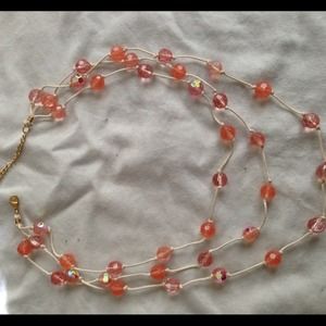 Peach bead necklace.