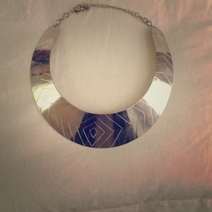 Silver choker necklace.
