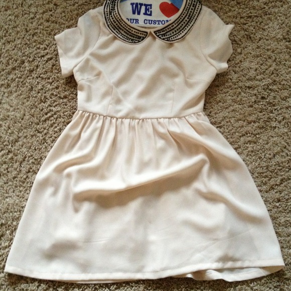 Size small ivory dress with black collar