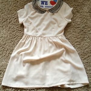 Size small ivory dress with black collar