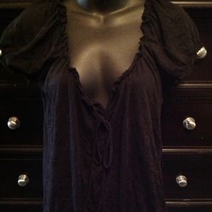 Great black top with cute white stitching detail