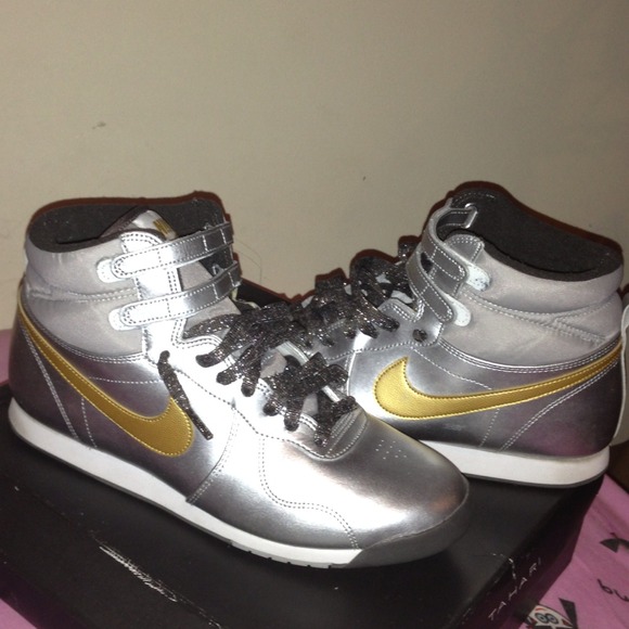 Silver with gold swoosh nike sneakers
