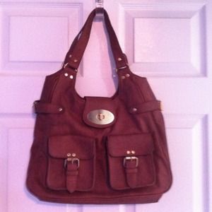 Tan shoulder bag. Zipper and buckle closure.