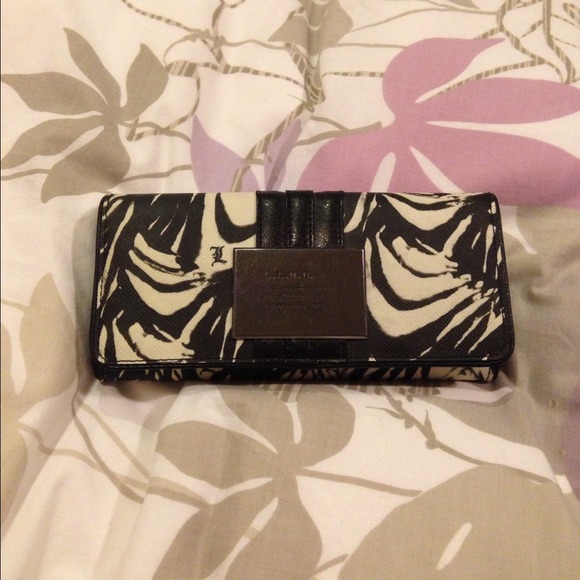 L.A.M.B. flap wallet. Used but in good condition.