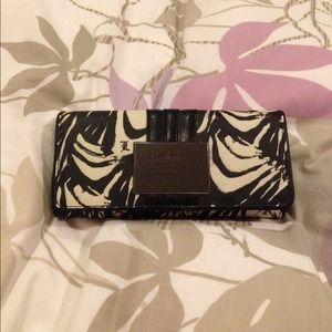 L.A.M.B. flap wallet. Used but in good condition.