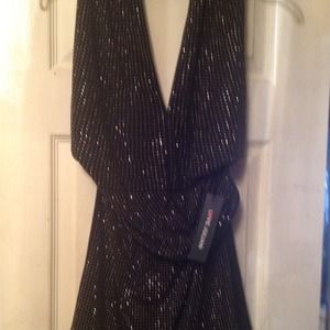 Black and silver dress back out