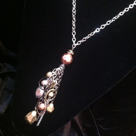 Gold, silver & rose gold tone dangle necklace.