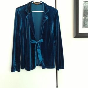 Turquoise velvet like jacket with ribbon closure.