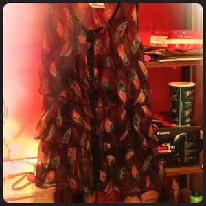 Sleeveless button up feather blouse