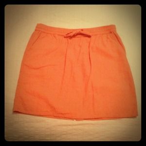 Coral color knee-length skirt