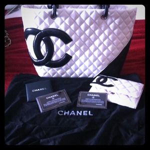 Black and white Chanel tote with matching wallet.