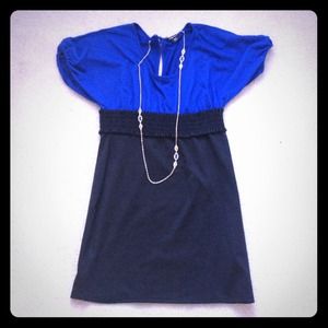 Royal blue and black fitted dress.