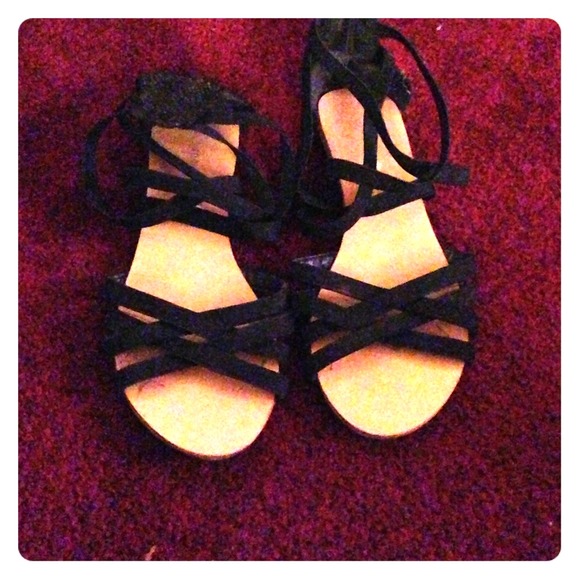 Black gladiator sandals.
