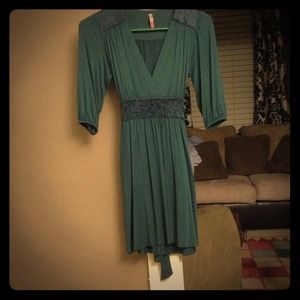 Casual jersey dress with feminine lace detailing.