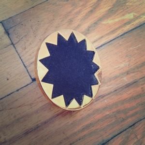 Gold and black leather ring