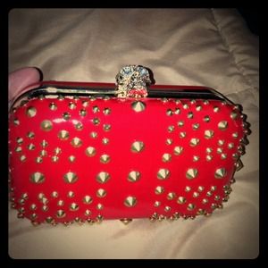 A studded clutch and side purse