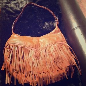 Fringed tan handbag