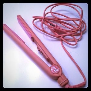 Pink ceramic straightening iron.