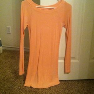 peach colored shirt