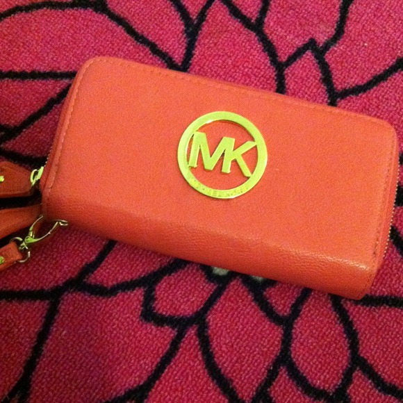 Faux Peach Pink Micheal Kors wallet.