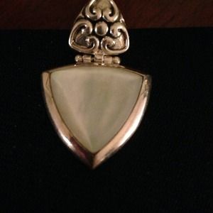 Sterling silver pendant with white opal like stone