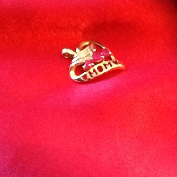 SOLD...10k gold pendant with three Rudy's