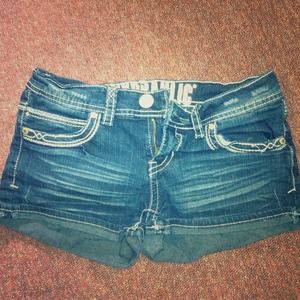 Dark wash denim shorts.