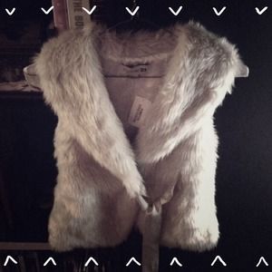 Cream faux fur vest.