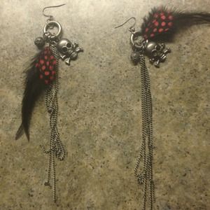 Skull feather earrings.