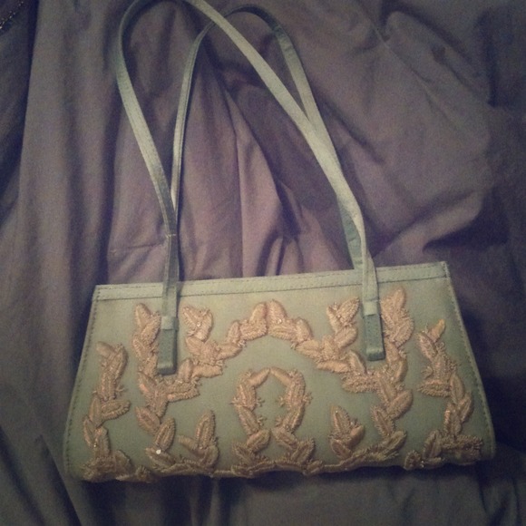 Ice blue small handbag. white stitching, beaded