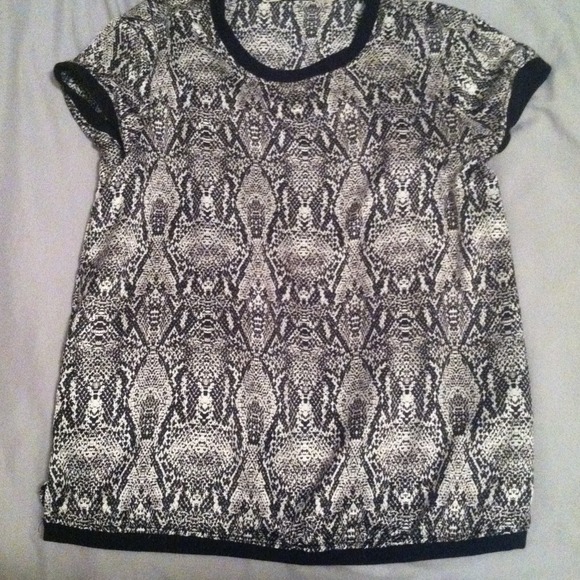 Snake skin print, silk shirt.