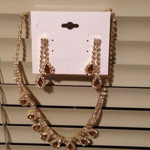 A brown and diamond earring and necklace set