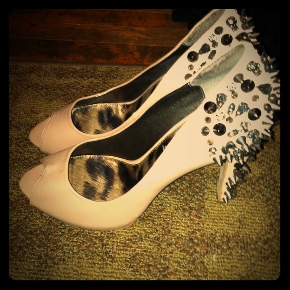 Nude peep toe pumps with gunmetal spike and studs