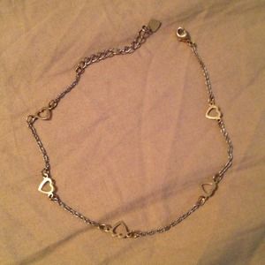 Gold and silver tone ankle bracelet.