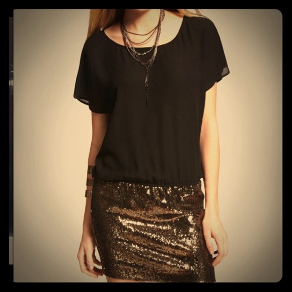 Drop waist dress with sequin skirt.
