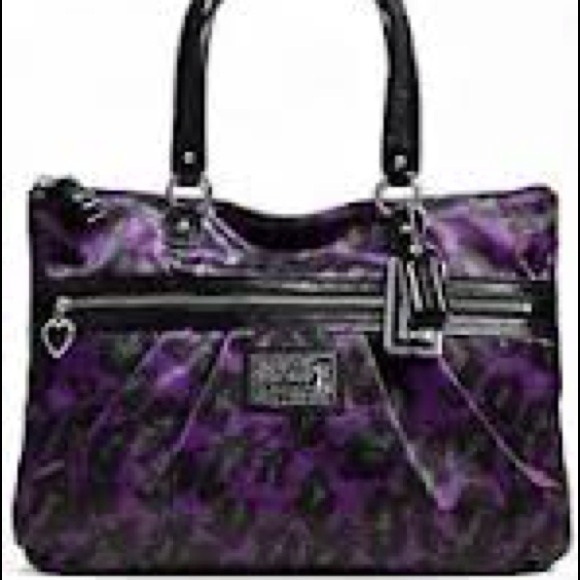 SOLD @alma Beautiful purple ocelot bag.