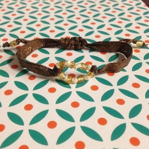 Bracelet with glass bead pendant.